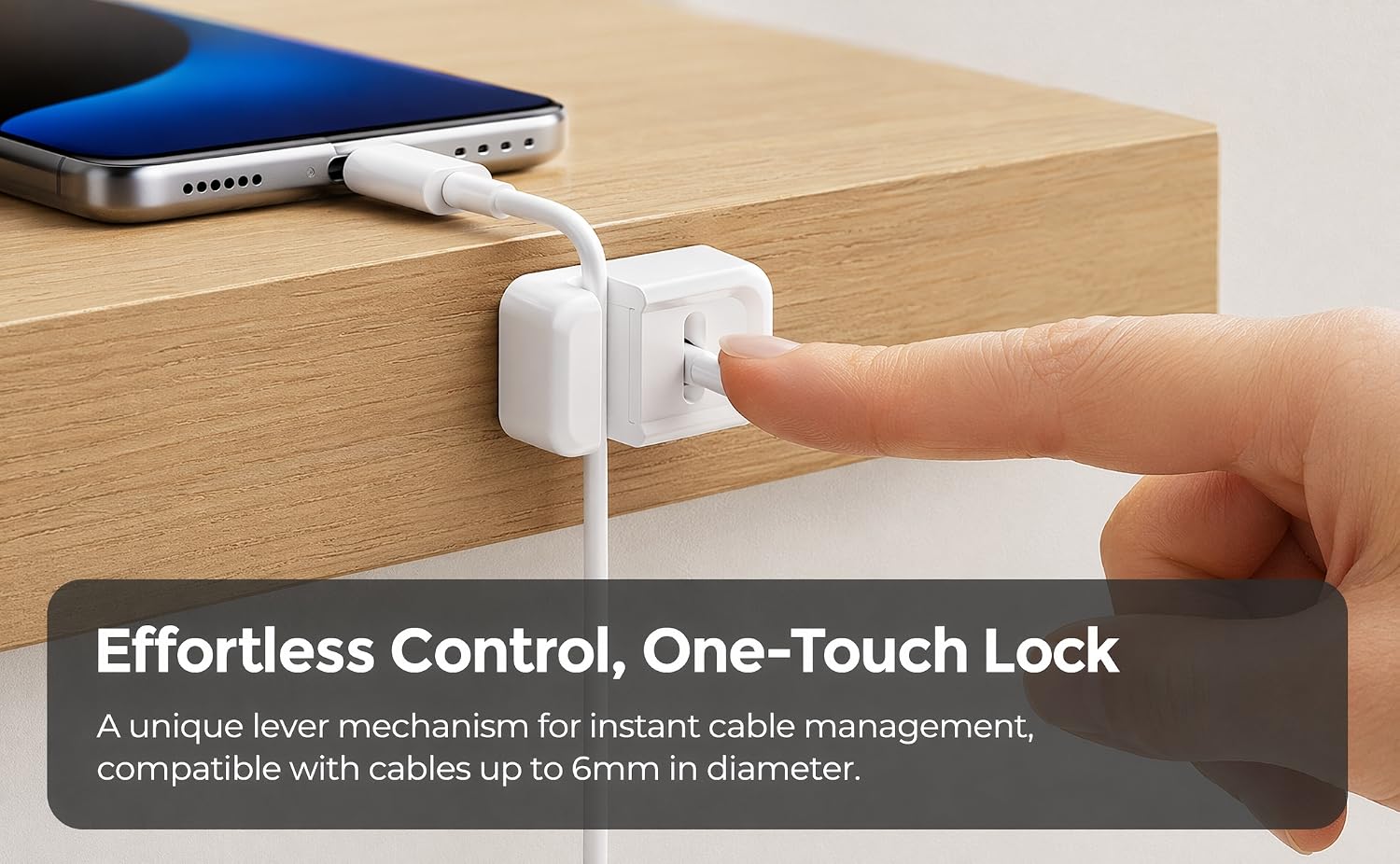 Hero lifestyle shot of our one-touch lever lock cable clip mounted on wooden desk edge